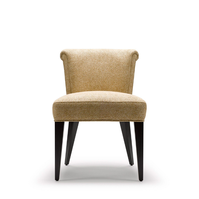 Upholstered beige chair with curved armrests and four dark wooden legs.