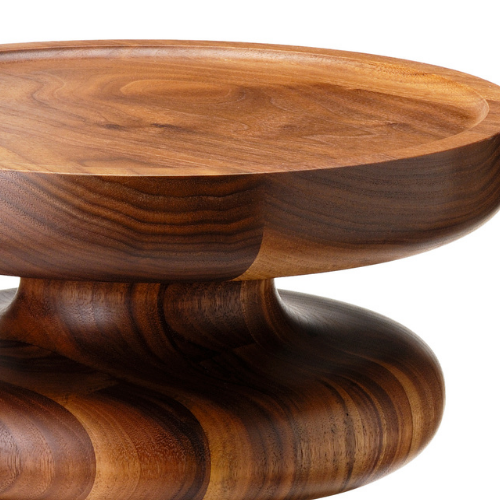 Close-up of a polished wooden bowl with a rounded base and smooth finish.
