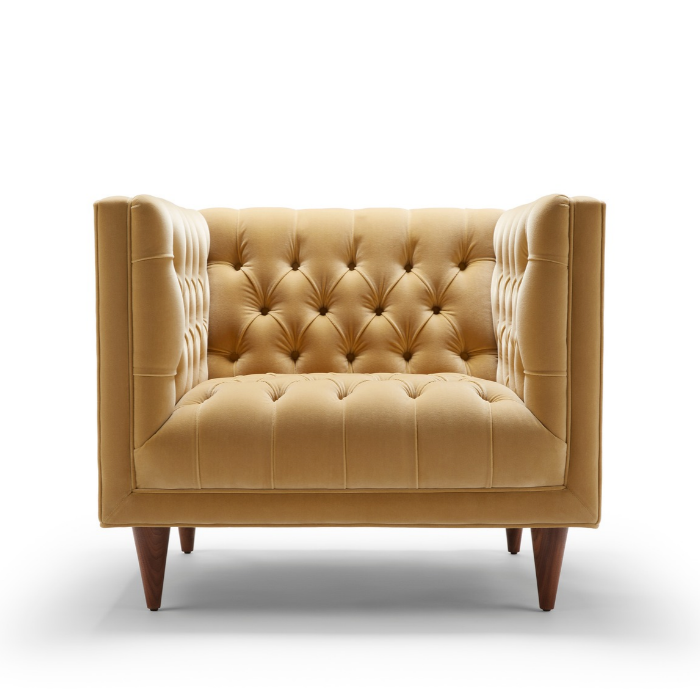 Beige tufted armchair with wooden legs on a white background.