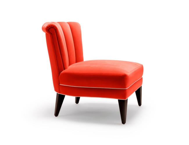 Isabella Occasional Chair shown here with black legs and upholstered in Dedar Piment cotton velvet. View from side.
