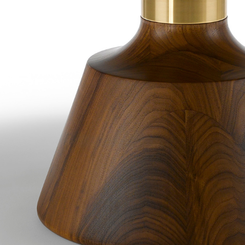 Close-up of a wooden lamp base with a brass top, showcasing a smooth, curved surface and natural wood grain patterns.