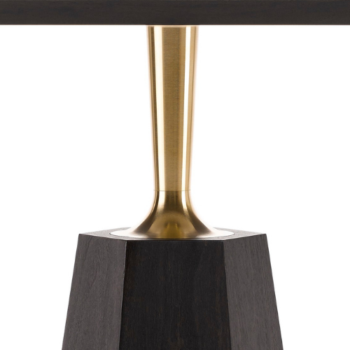 Close-up of a table's supporting structure with a black wooden base and a gold-colored metal column connecting to the tabletop.