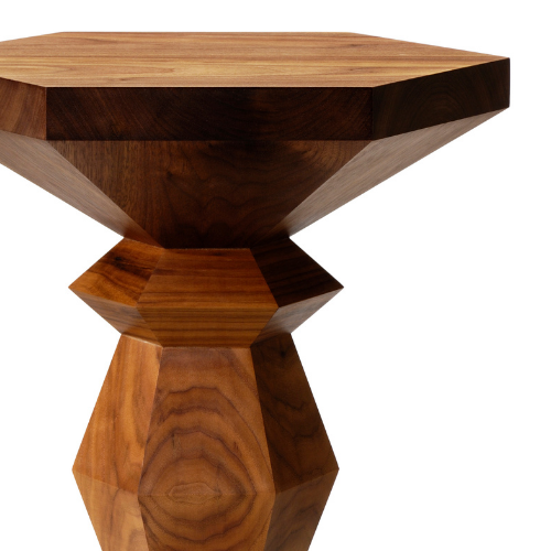 Wooden side table with a geometric design, featuring a wide hexagonal top and a faceted base.