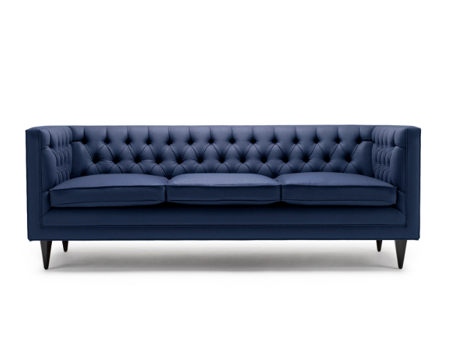 A dark blue tufted three-seat sofa with angled black legs