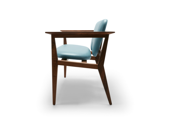 Side view of a wooden chair with a light blue cushioned seat and backrest, set against a white background.