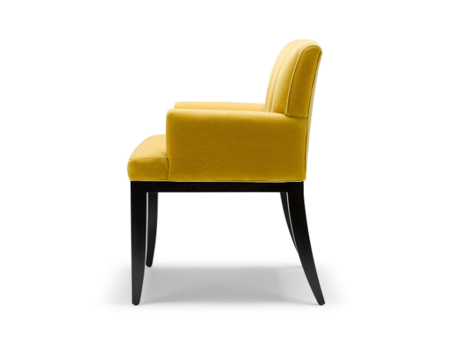 Side view of a yellow upholstered chair with black legs against a white background.