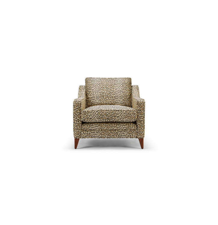 Leopard print upholstered armchair with wooden legs against a white background