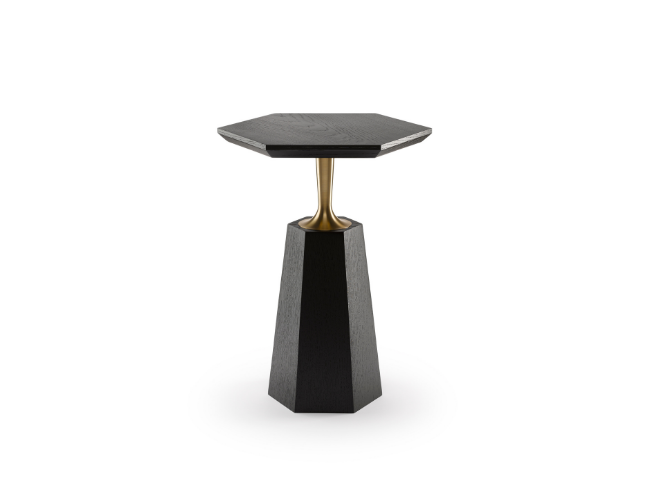Modern side table with a black textured hexagonal top, a gold stem, and a black angular base