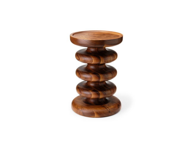 Wooden stand with a spiral, sculptural design on a white background.