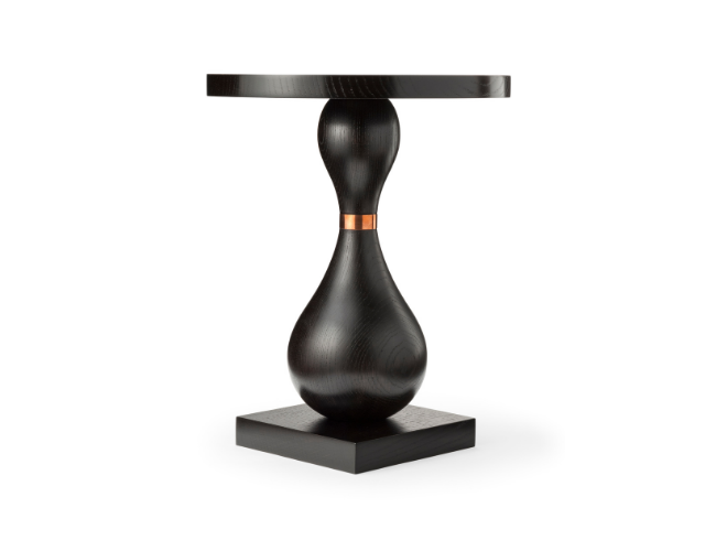 Black side table with a round top, a bulbous midsection, and a square base, featuring a metallic accent around the narrow waist.