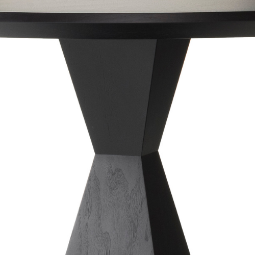 Close-up of a black wooden table with a triangular, X-shaped base.