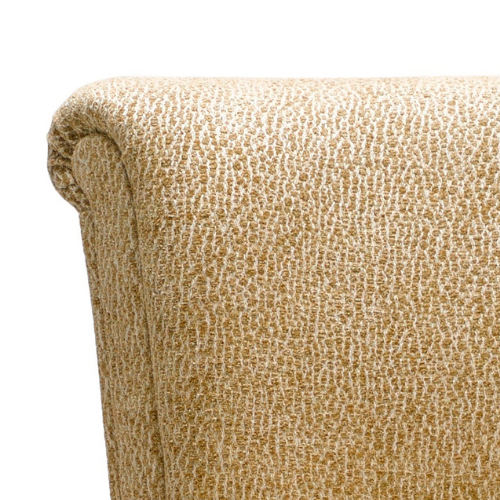Close-up of a beige upholstered armchair with a textured fabric.
