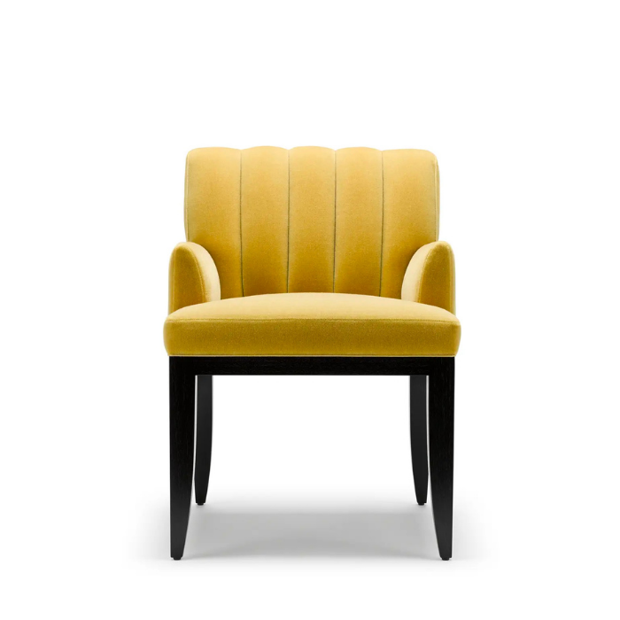 Yellow upholstered armchair with black wooden legs on a white background.