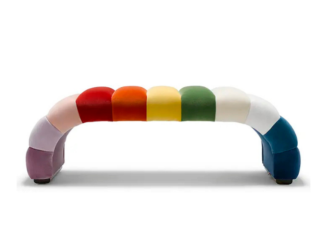 Colorful upholstered modular sofa with a rainbow pattern on a white background.