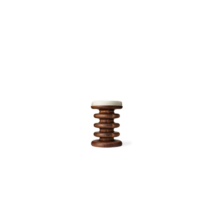 A modern wooden stool with a white cushioned top, featuring a spiral design in dark brown wood.