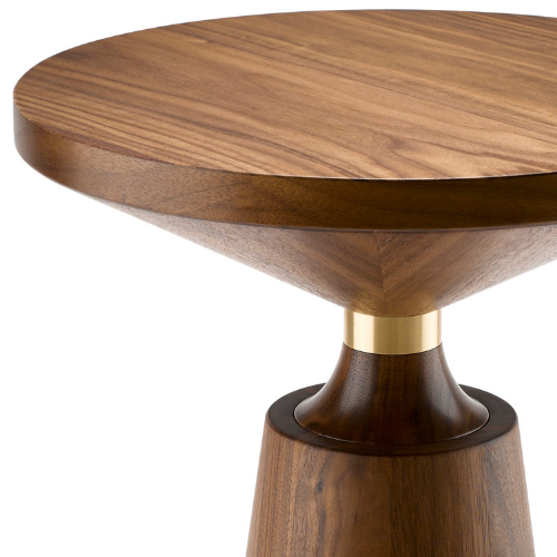 Close-up of a wooden side table with a rounded top, gold accent, and a tapered base.