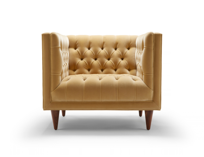 A beige tufted loveseat with wooden legs, isolated on a white background.
