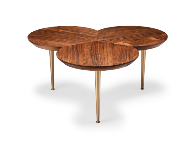 A modern wooden coffee table with three interconnected oval tops and gold-colored tapered legs.