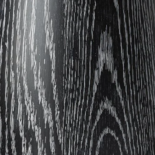 Close-up of a black wood grain texture pattern.