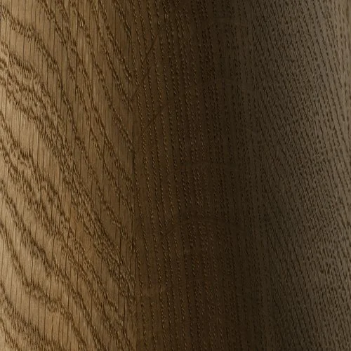 Close-up of a wooden surface with a textured grain pattern.
