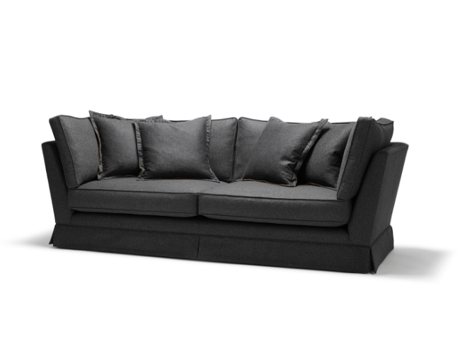 A black fabric upholstered sofa with seven matching black cushions on a white background.