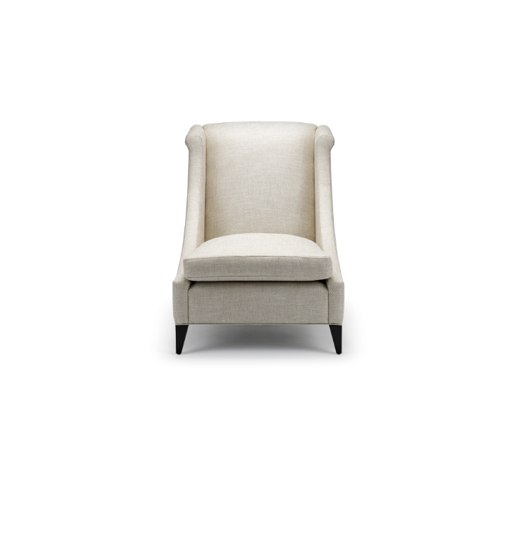 A beige upholstered armchair with a high back, winged sides, a cushioned seat, and dark wooden legs set against a white background.
