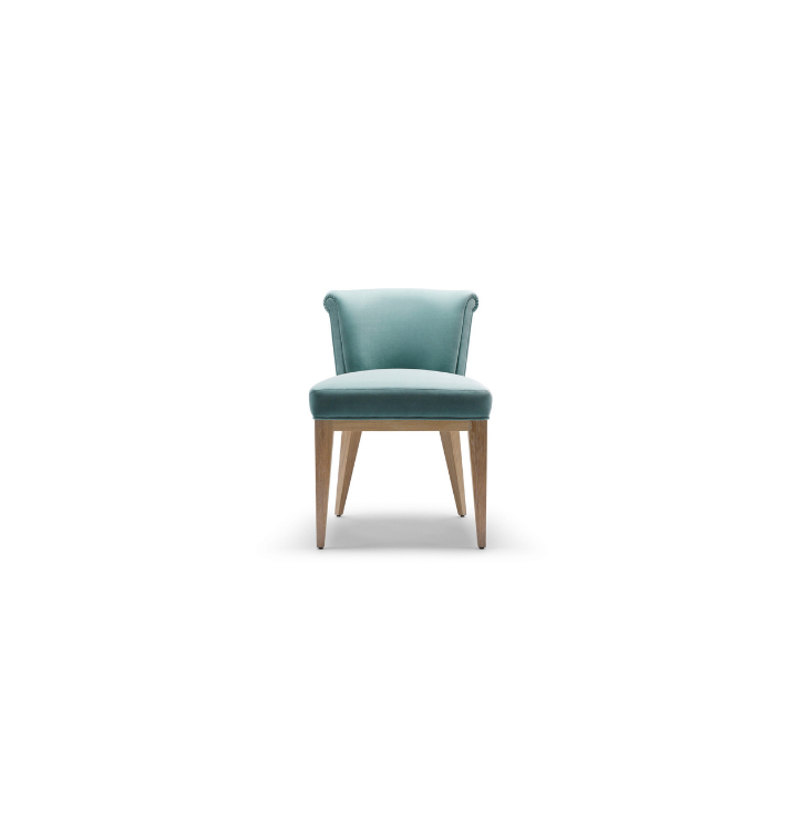 A light blue upholstered chair with wooden legs isolated on a white background.