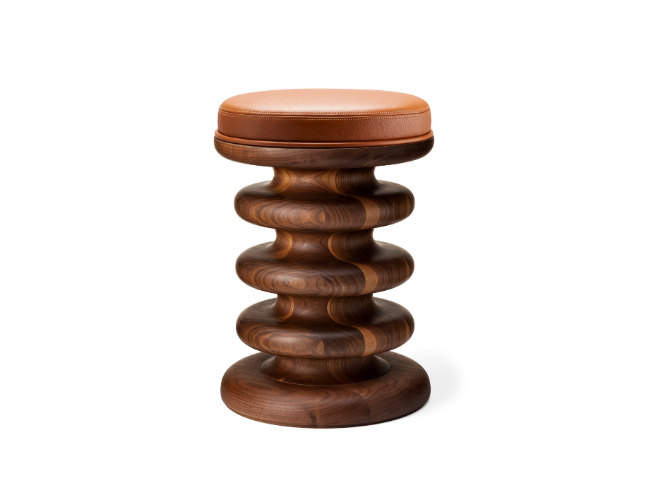 Wooden stool with a padded leather seat.