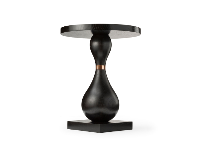 Black wooden side table with a round top and an hourglass-shaped base on a square platform.