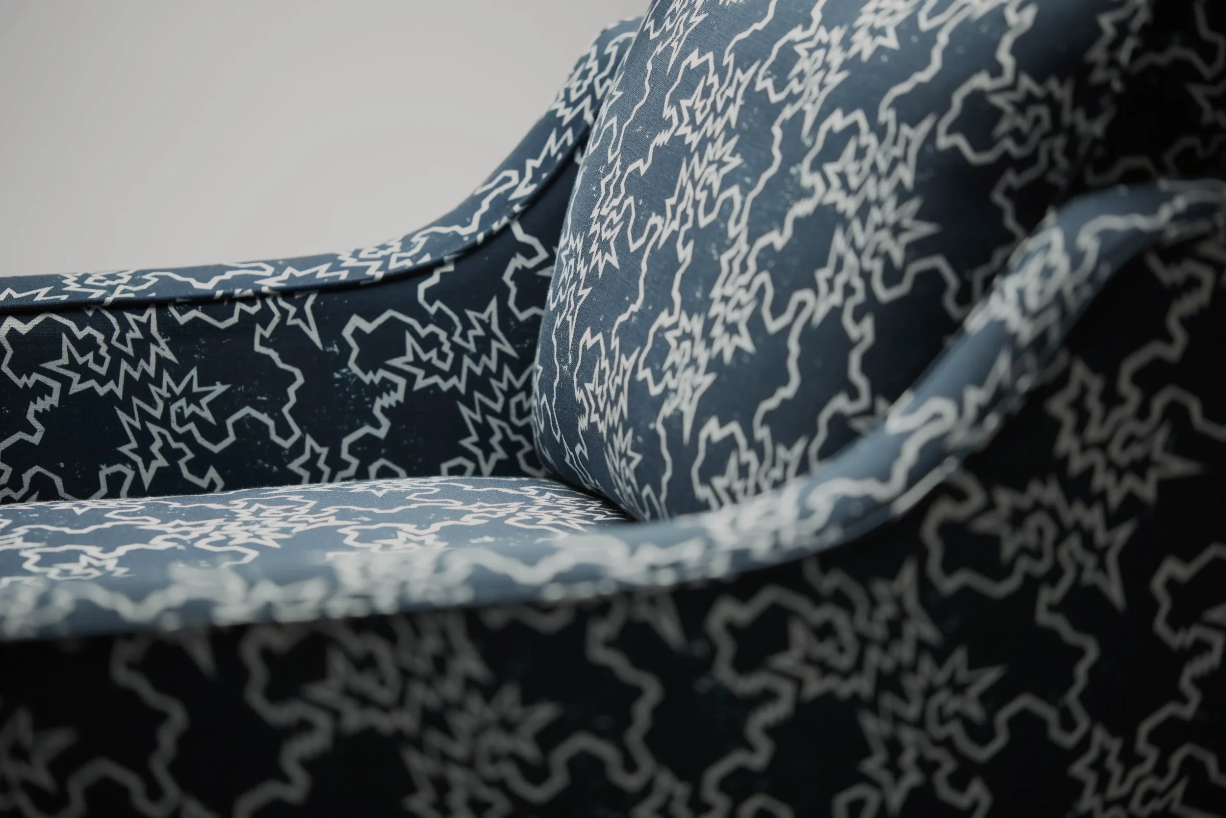 Close-up of the Reposer Chair made using Liberty Fabric, showcasing one of their fabric collections.