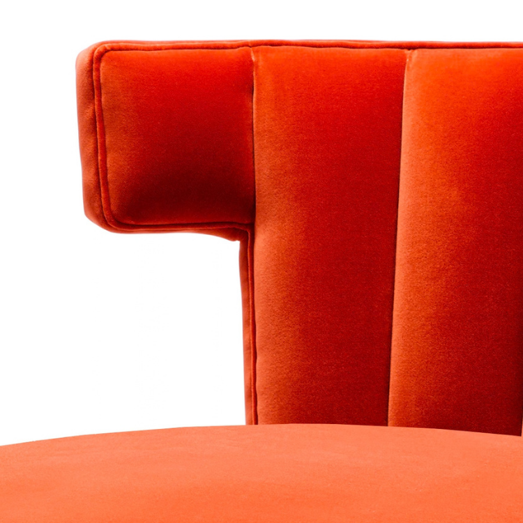 Close-up of an orange upholstered chair's backrest and seat with white background.