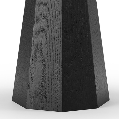 Close-up of a black wooden table leg with a tapered design.