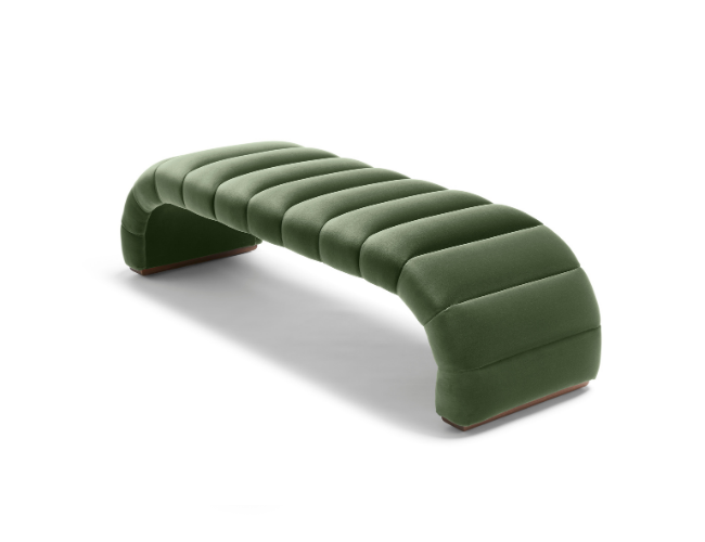 Green upholstered curved bench with segmented cushion design on a white background.