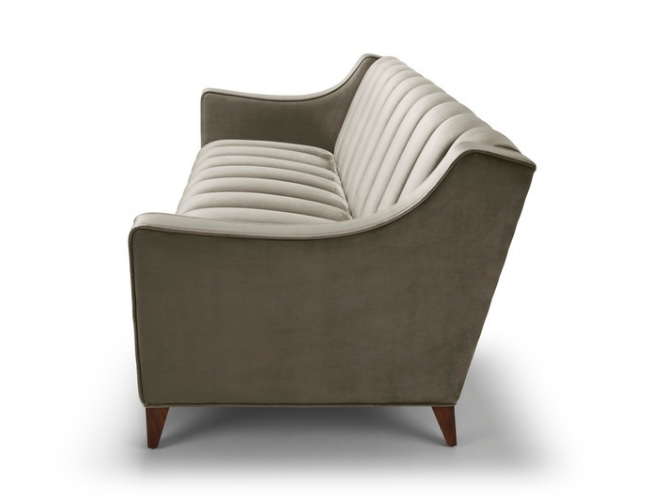 A modern two-tone armchair with a curved design, featuring a gray exterior and white, striped cushioned interior.