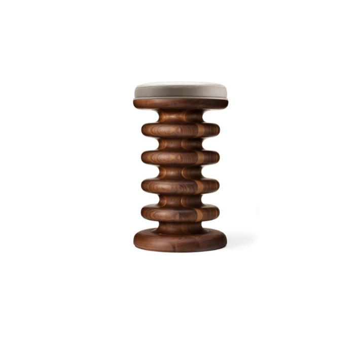 Wooden stool with spiral design and cushioned top against white background.