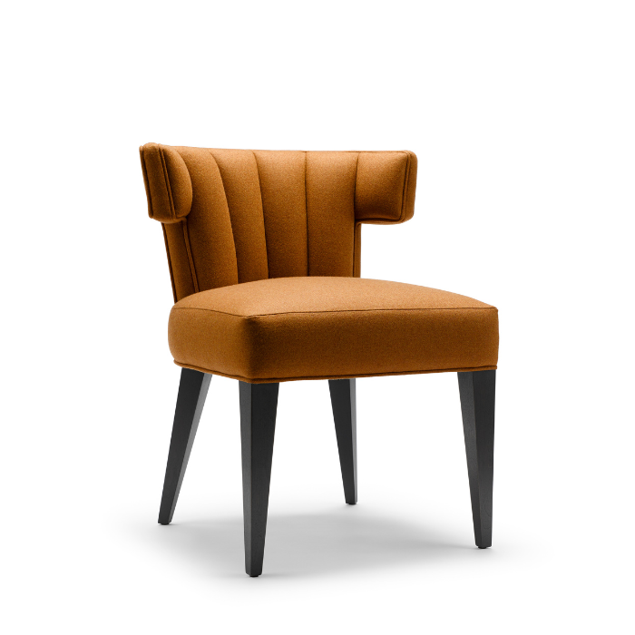 Brown upholstered accent chair with vertical stitching, four black wooden legs, isolated on white background.