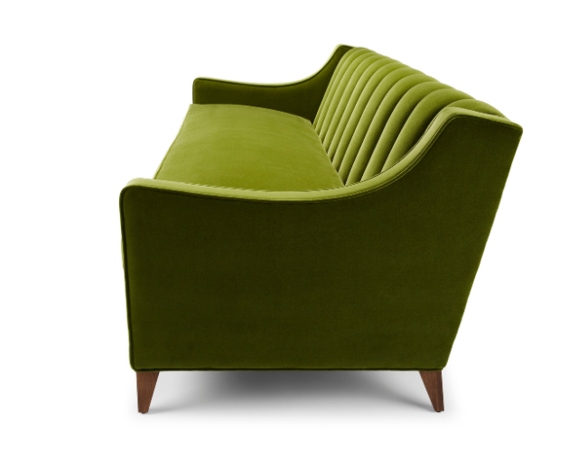 Green velvet sofa with rolled arms and vertical channel tufting, wooden legs