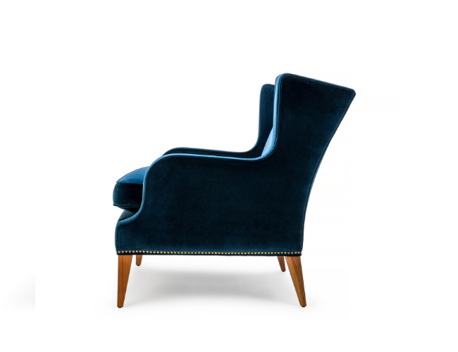 The Alae Lounge by Stuart Scott Furniture. Close up showing the chair from the side.
