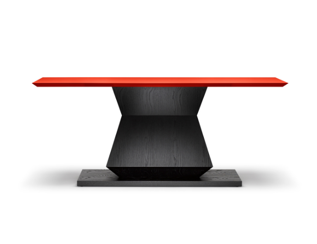 Modern table with a red top and black geometric base.