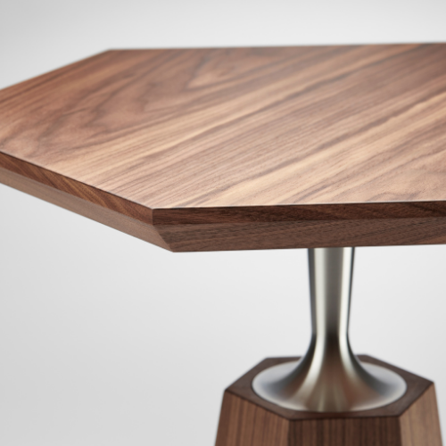 Close-up of a wooden table with a metal pedestal base against a plain background.