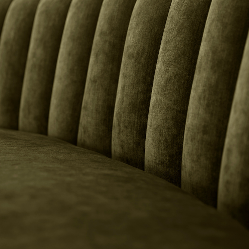 Close-up of a green upholstered bench or booth with vertical cushions.