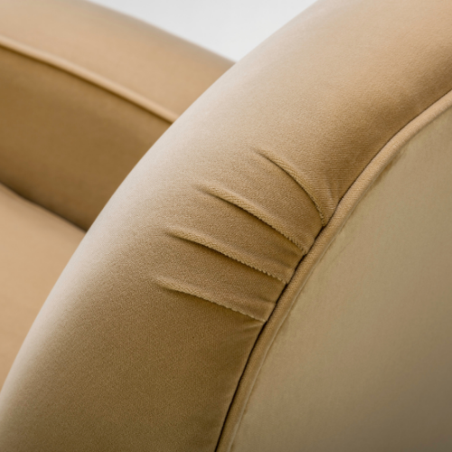 The Henri Armchair by Stuart Scott Furniture. Close up showing the pleats on the chair.