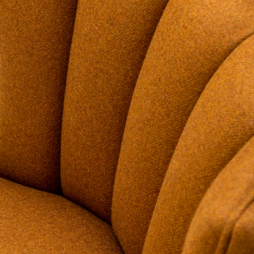 Close-up of an orange upholstered chair with textured fabric and curved design.