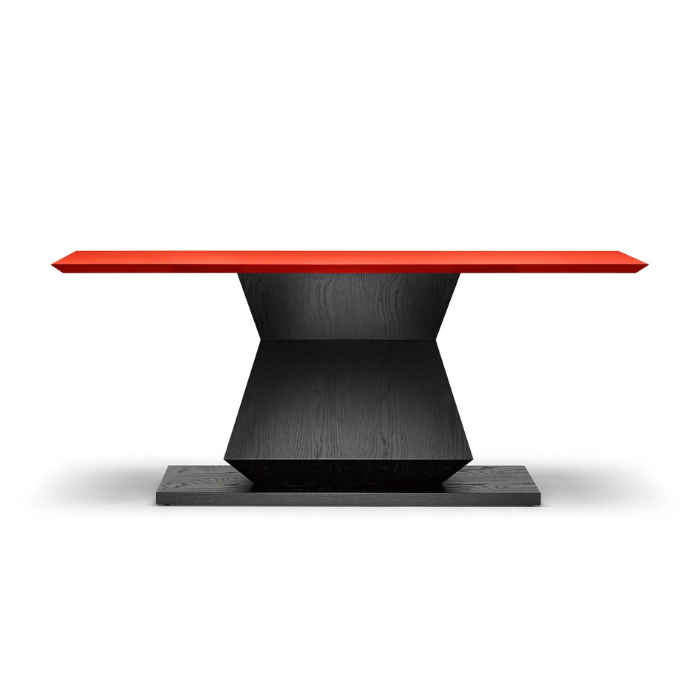 Modern table with a black base and a red tabletop.