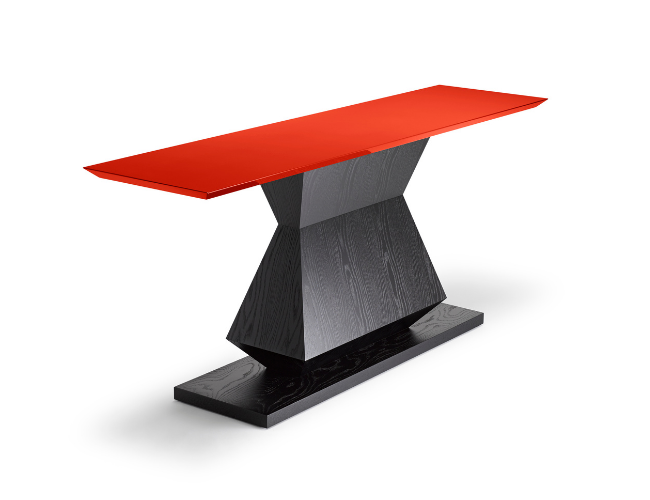 Modern dining table with a red tabletop and a black wooden base.