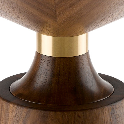 Close-up of a wooden table or furniture piece with a rounded base, accentuated by a gold metallic band.