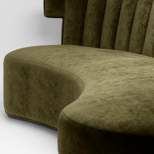 Close-up of a green upholstered bench or chair with a curved design and vertical backrest.