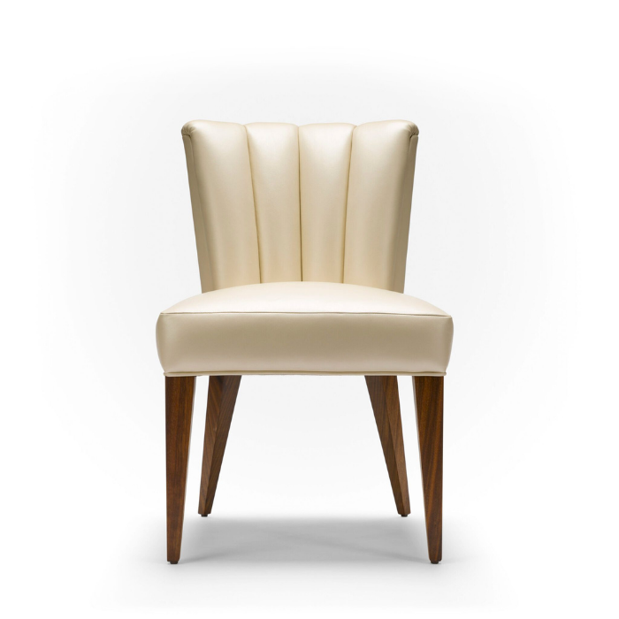 Cream-colored upholstered chair with wooden legs on a white background.