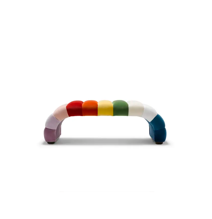 Colorful striped couch with rainbow colors on a white background.