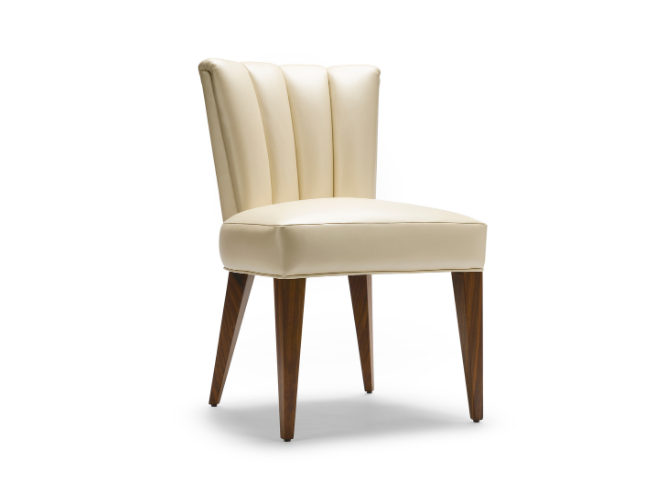 A beige upholstered chair with a high, padded backrest and wooden legs.